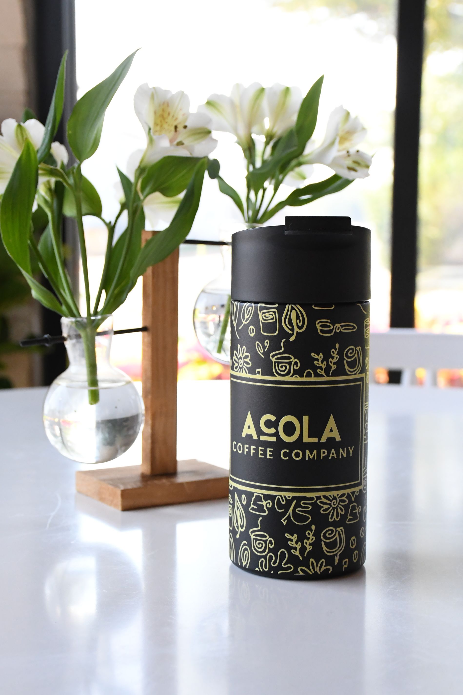 Black and gold doodles travel mug from Acola Coffee Company Columbia MO