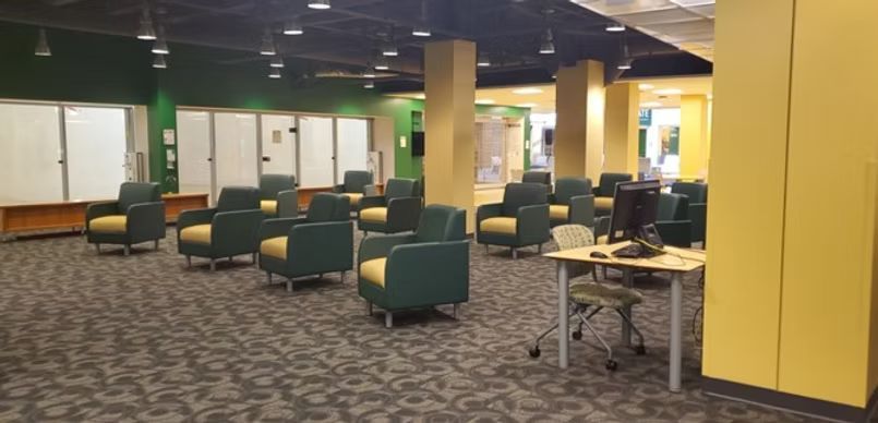 There are a lot of chairs and tables in this room.
