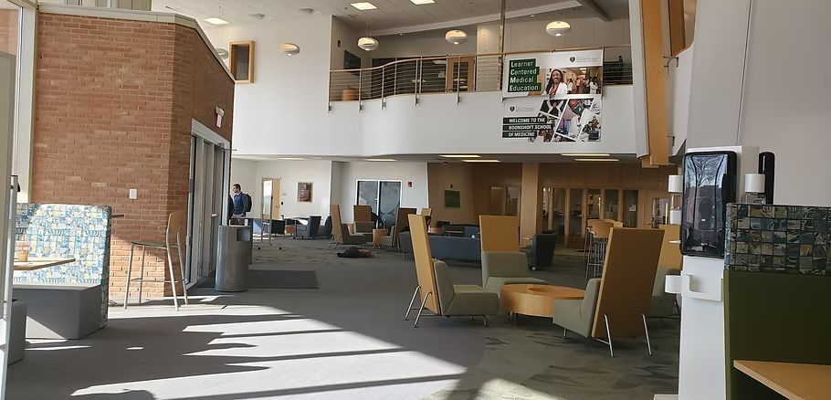 A large room with a water cooler in the middle