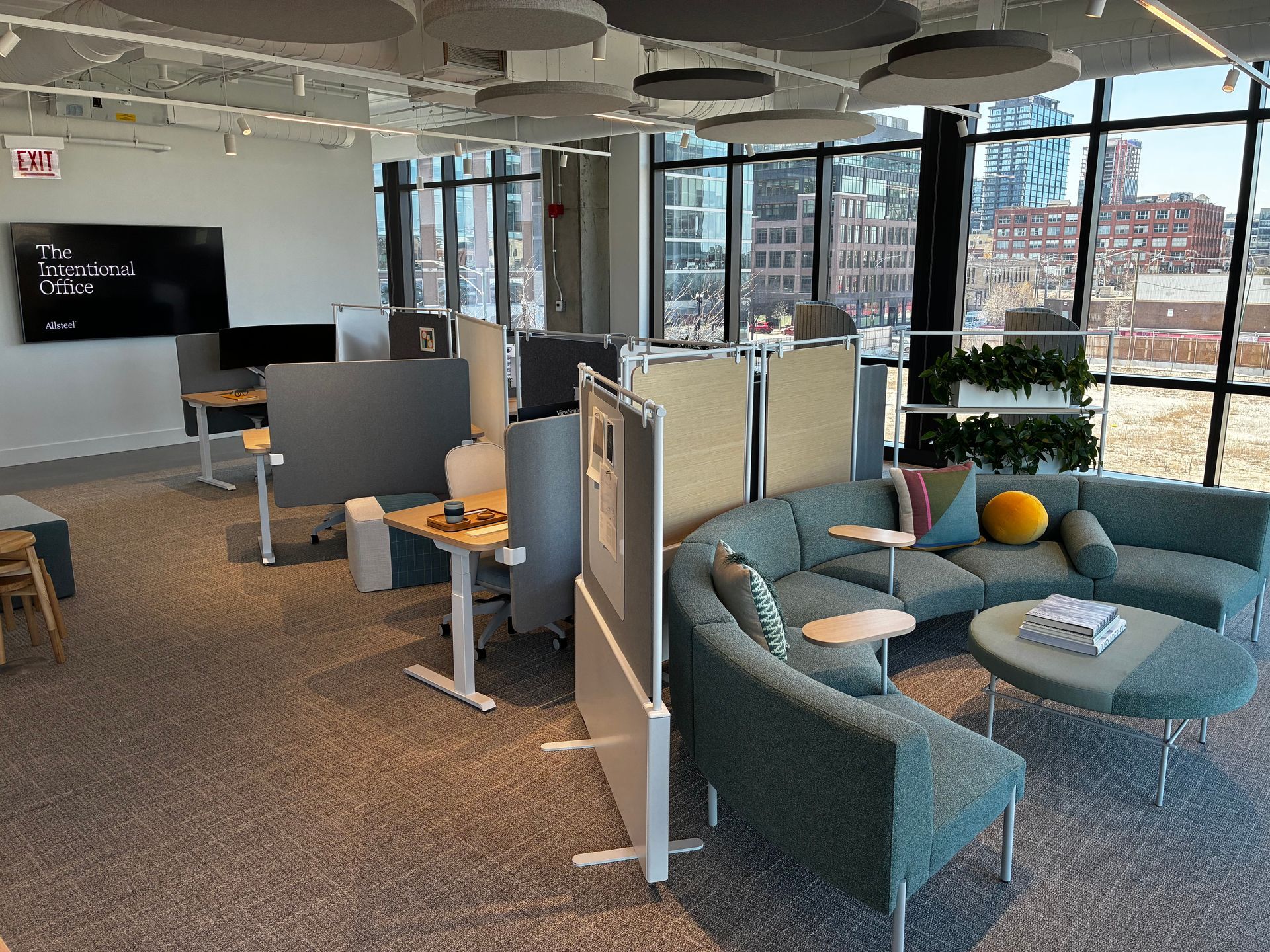 A large room with a lot of furniture and a lot of windows.