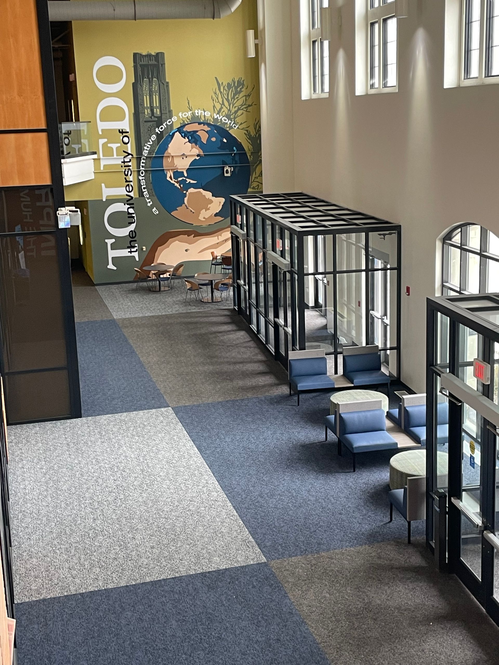 A large room with a mural on the wall that says toledo