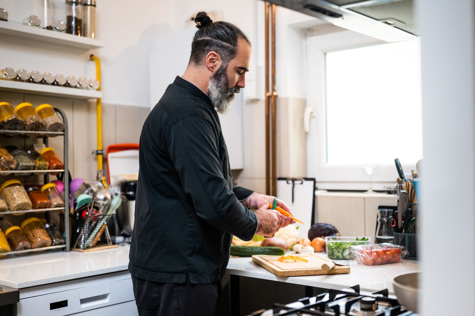 Professional chef is preparing meal in restaurant's kitchen. Professional chef is preparing meal in restaurant's kitchen.