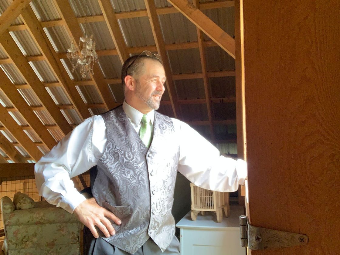 DJ dressed in formal attire for an event