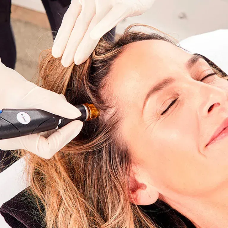 A woman is getting a hydrafacial treatment Huntington Beach
