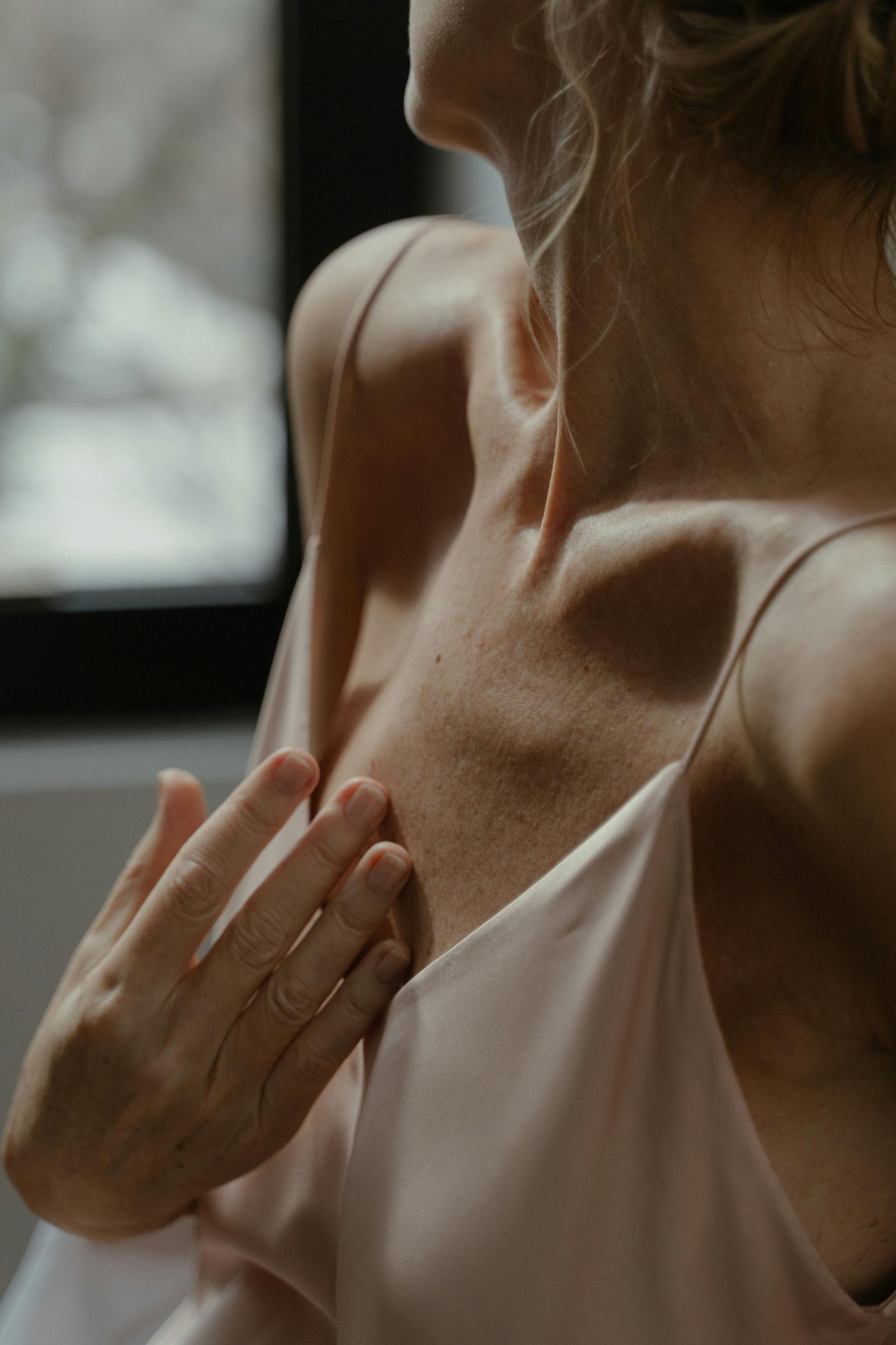 A woman is getting a laser hair removal treatment on her arm.