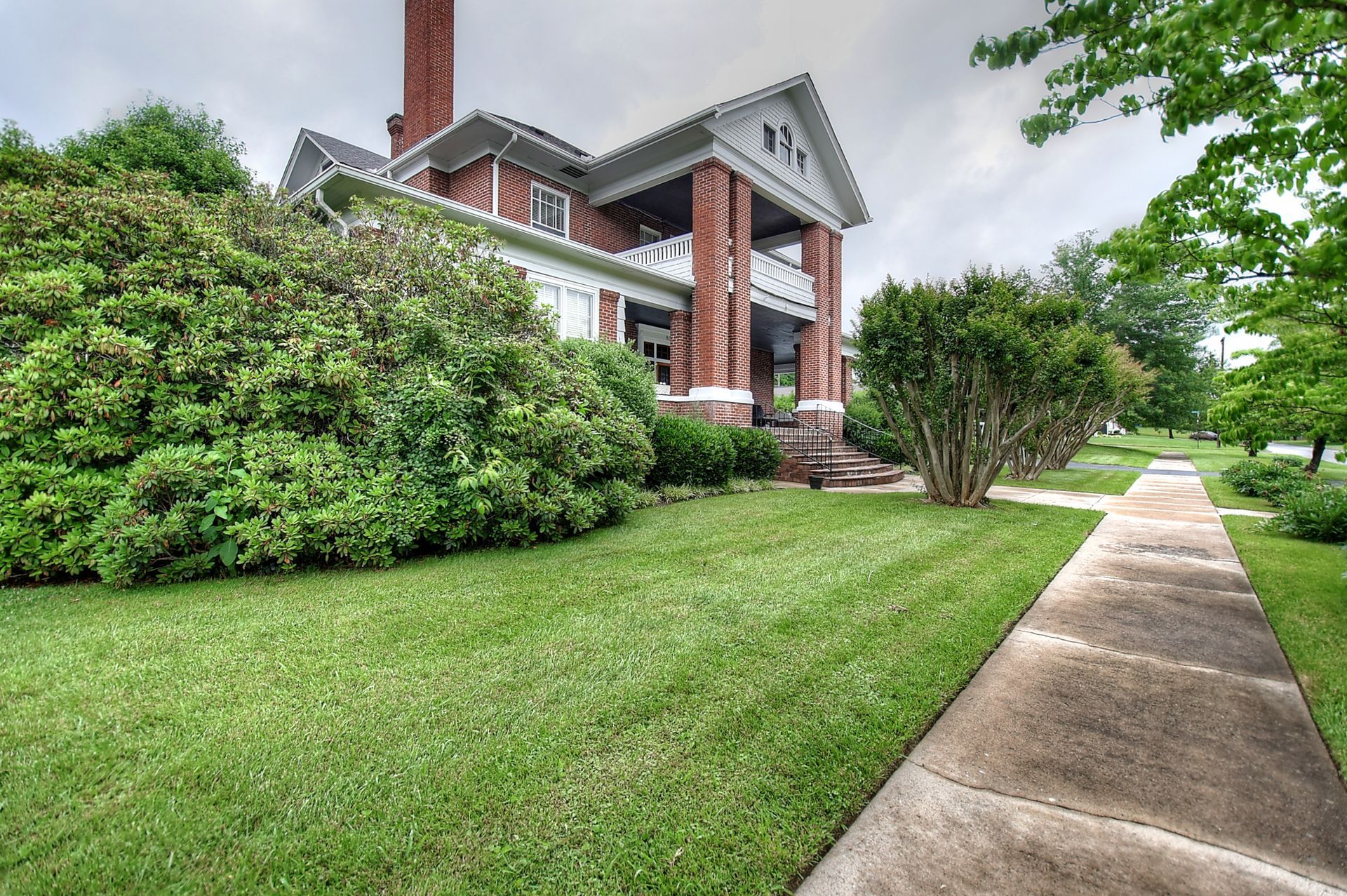 A large house with a walkway leading to it