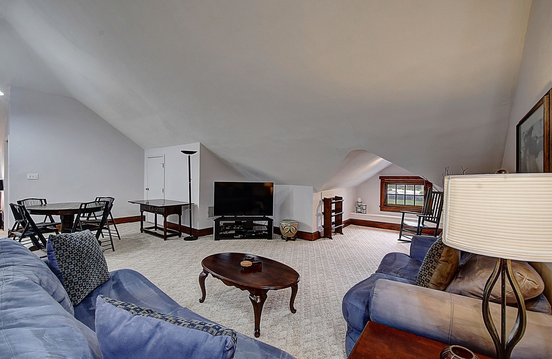 A living room filled with furniture and a flat screen tv