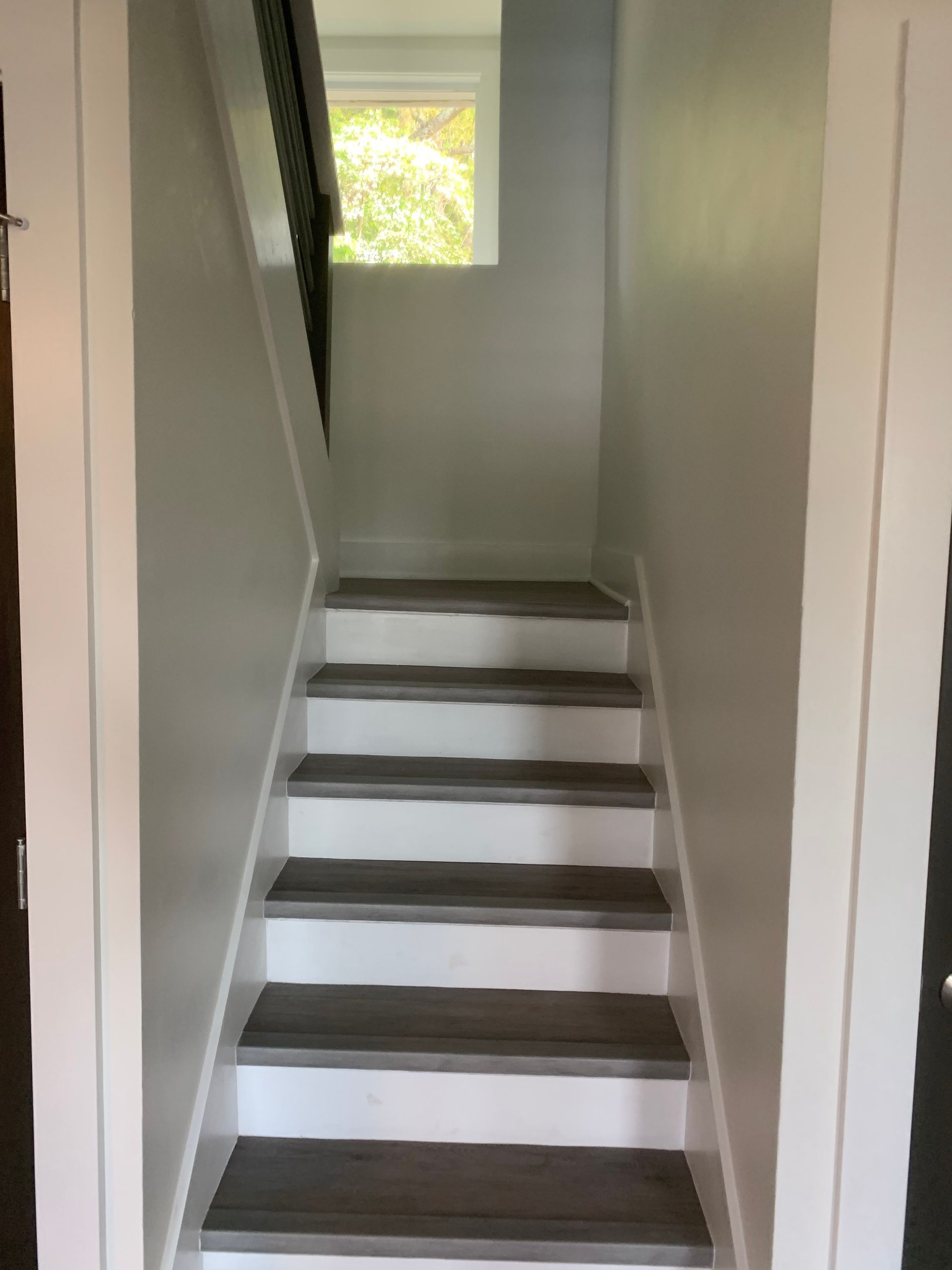 A set of stairs leading up to the second floor of a house.