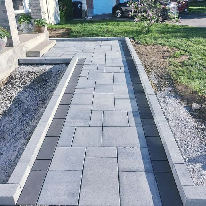 A walkway is being built in front of a house