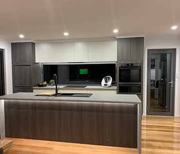 A kitchen with a large island in the middle of the room.
