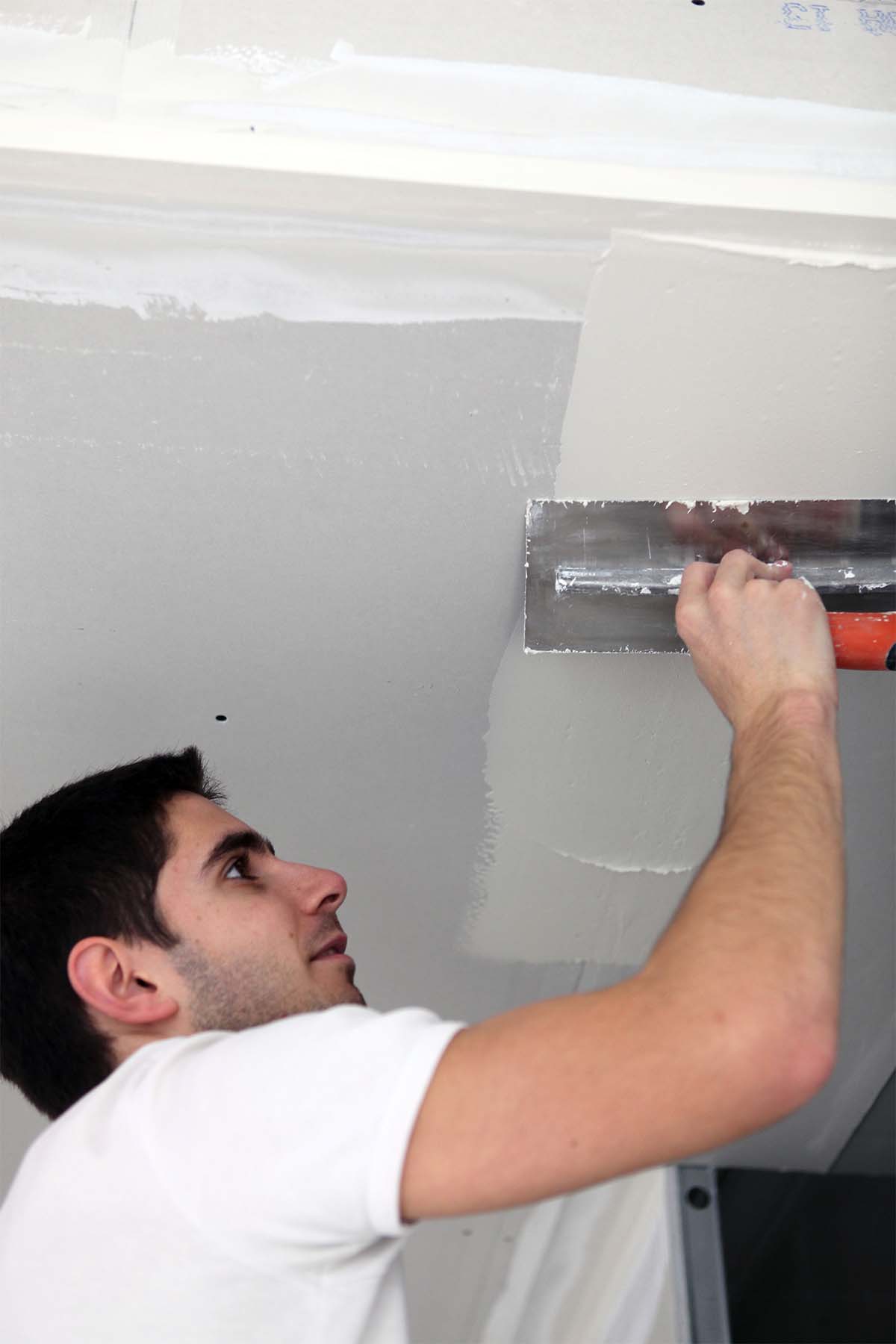 Cairns Plasterer Carrying Out Repair To A Damaged Gyprock Ceiling