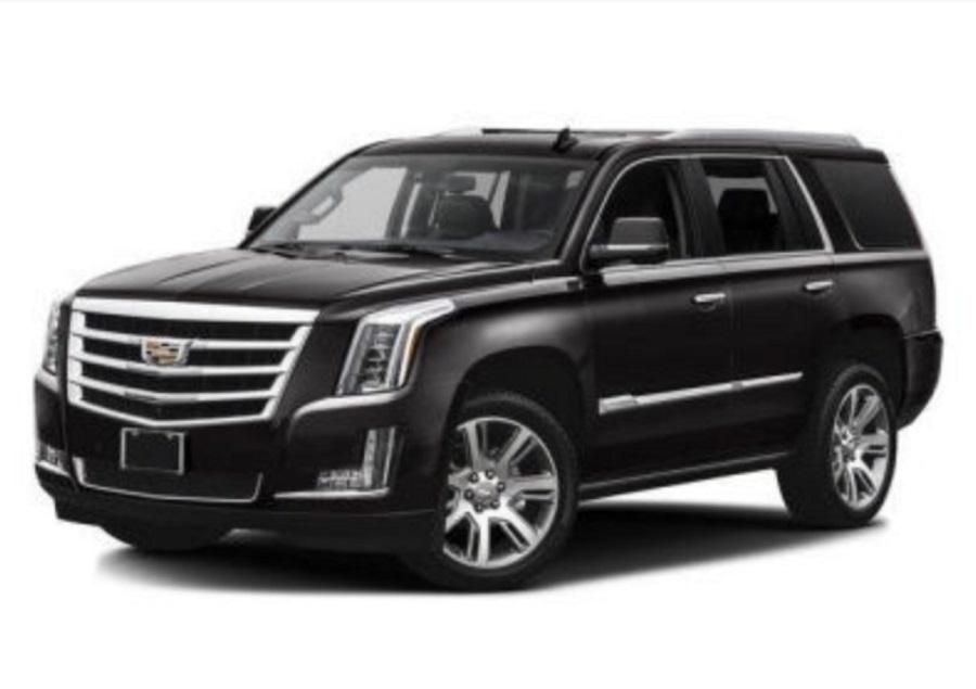 A black cadillac escalade is shown on a white background.