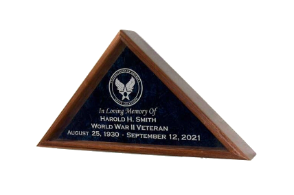 A wooden triangle shaped plaque with a picture of an eagle on it.