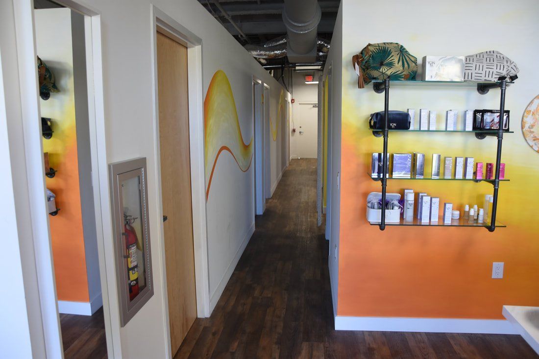 A long hallway with shelves filled with beauty products