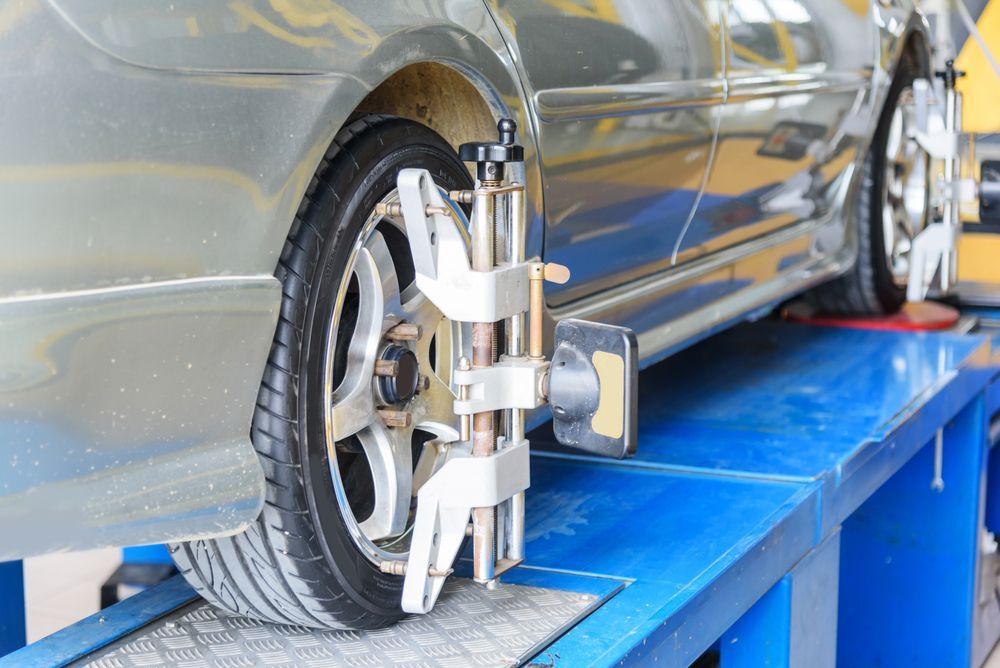 Car Wheel on Alignment Machine in an Auto Repair Shop — Mareeba Tyre Centre in Mareeba, QLD