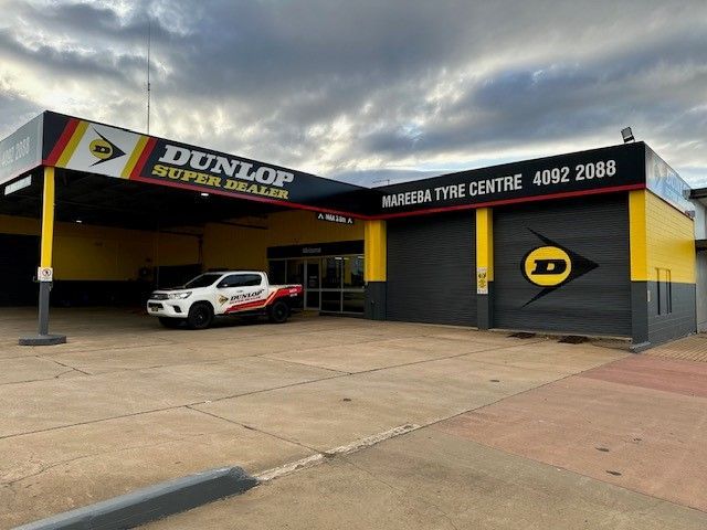 Dunlop Tire Center Storefront With a White Car Parked Outside — Mareeba Tyre Centre in Mareeba, QLD