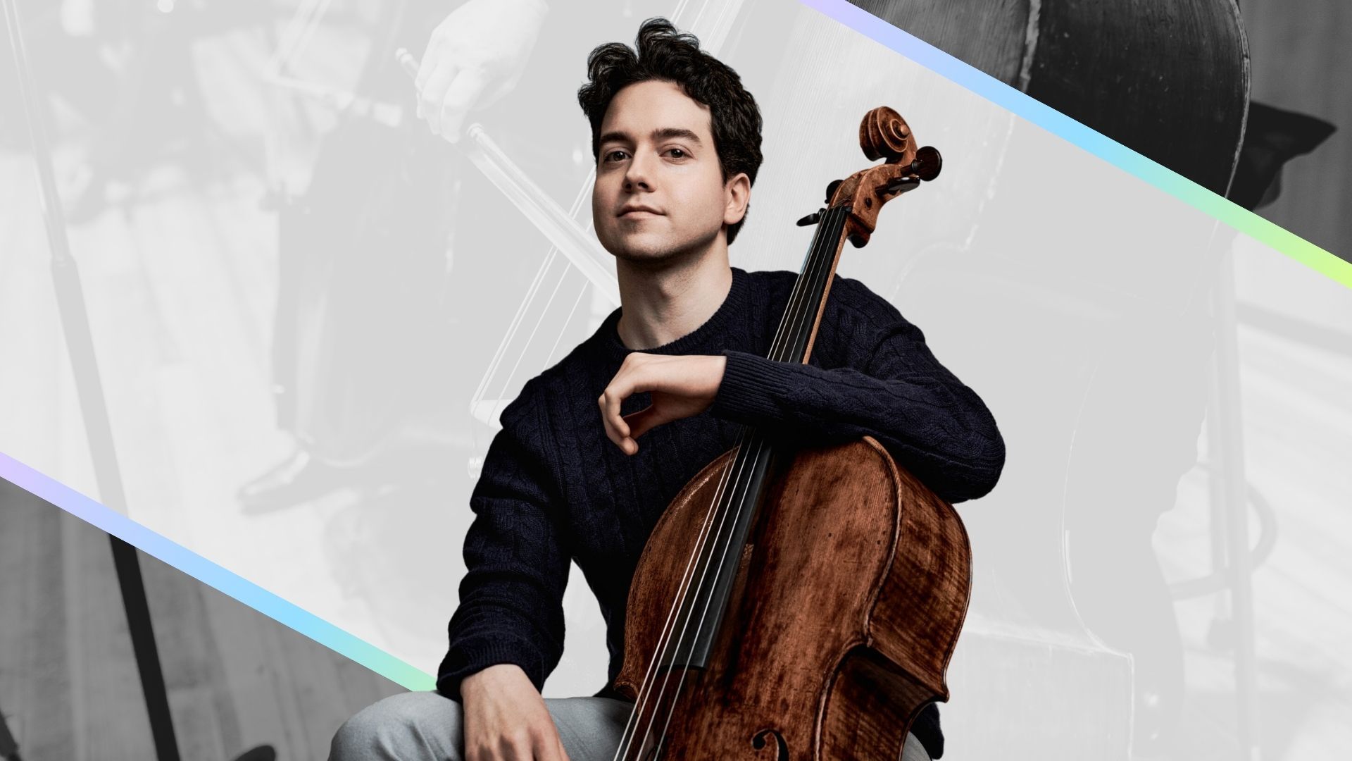 Cellist posing with a cello against a light gray and black abstract background