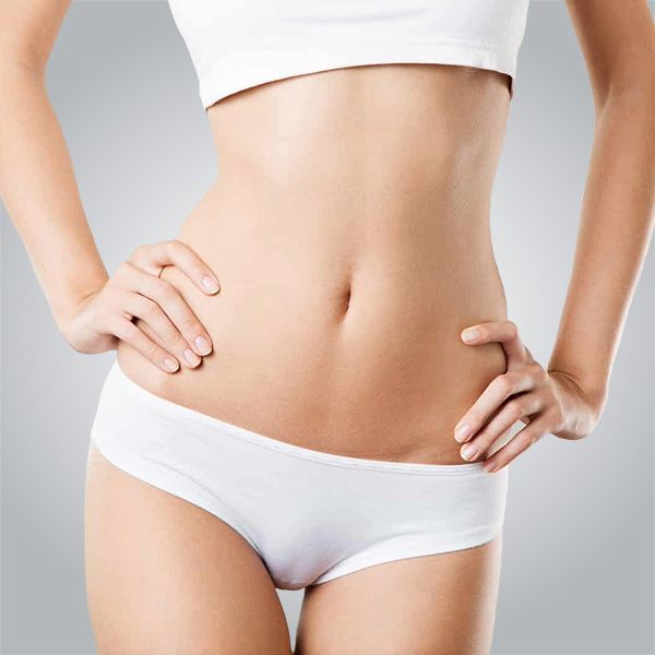 the woman is wearing white underwear and a white top .