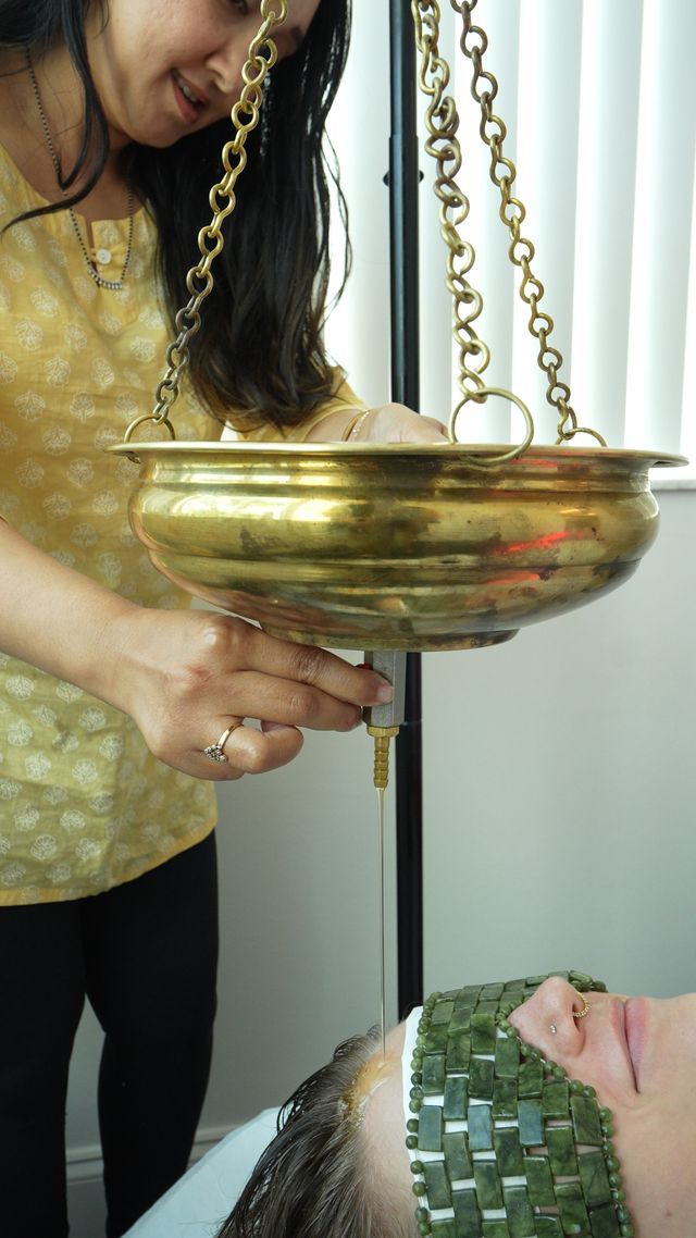 Hand pointing to a circular day-night schedule chart on a tabletop