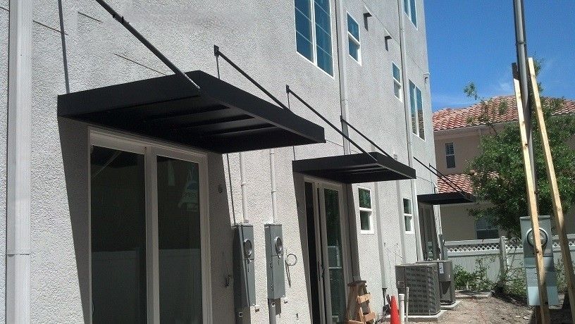 A large building with a balcony and a ceiling fan