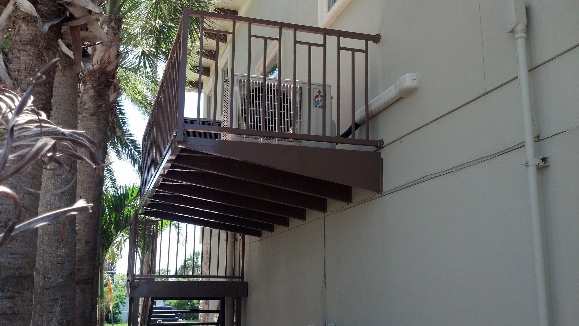 A balcony with a view of a body of water