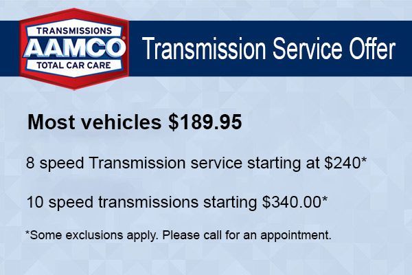 AAMCO Transmission Service Offer sign with prices for most vehicles and special transmission services.