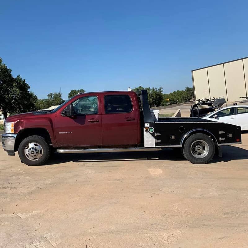 Norstar western hauler bed black in color mounted on maroon chevy truck side view