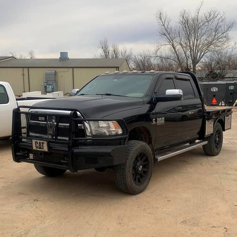 black dodge 4 door truck with black skirted bed 