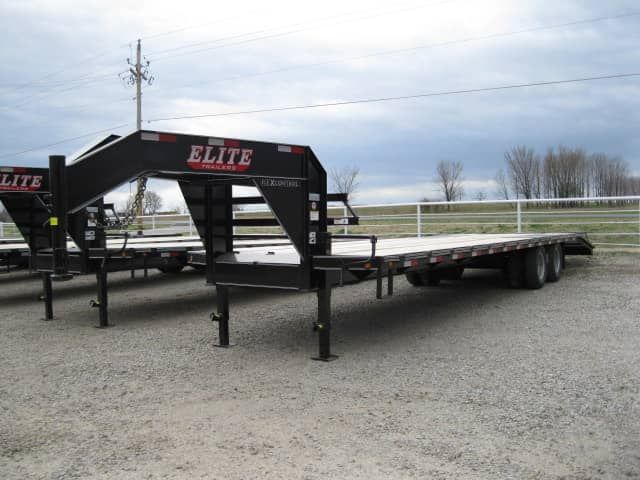 black gooseneck trailer with wood floor