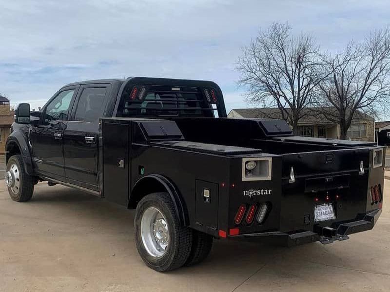 photo truck with black  Norstar steel bed