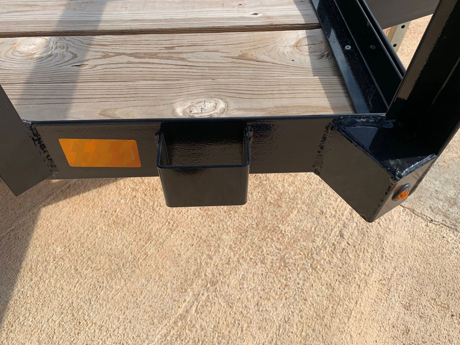 stake pocket tie down point on black utility trailer