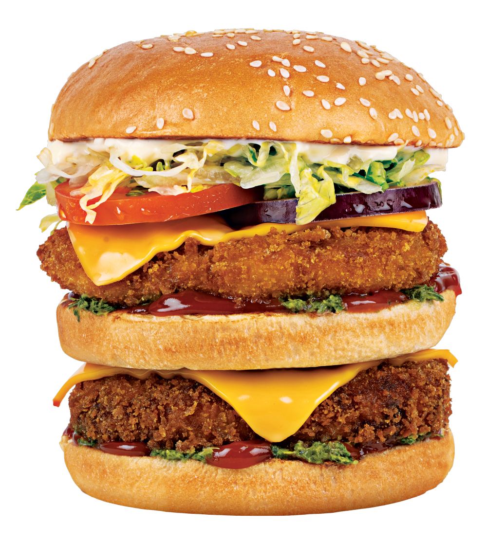 Double-decker burger with sesame seed bun, two patties, cheese, tomato, lettuce, and red onion.