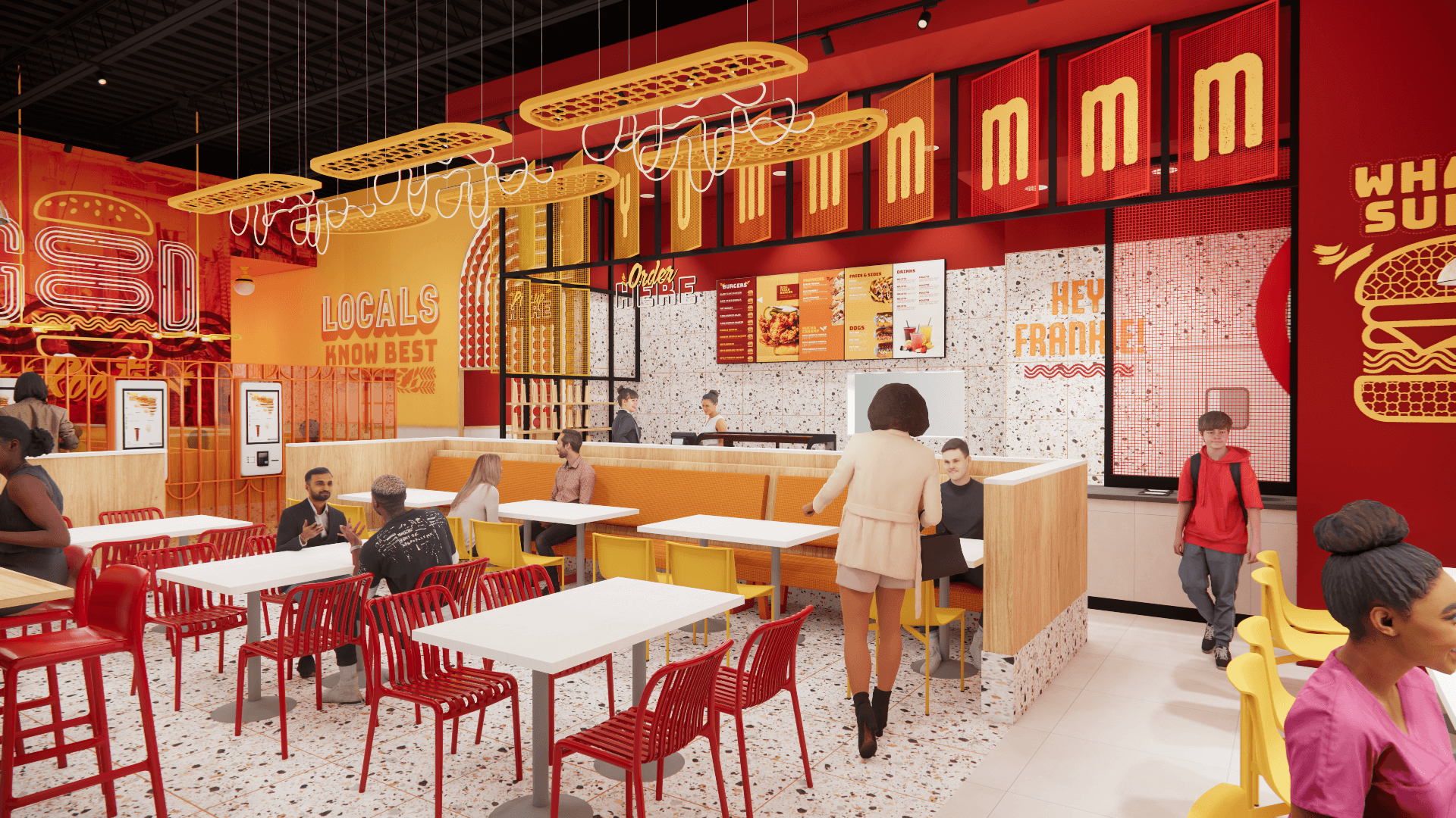 Interior of a modern McDonald's restaurant in red and yellow tones with patrons at tables.