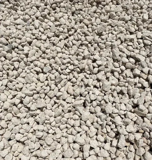 A pile of white gravel is sitting on the ground.