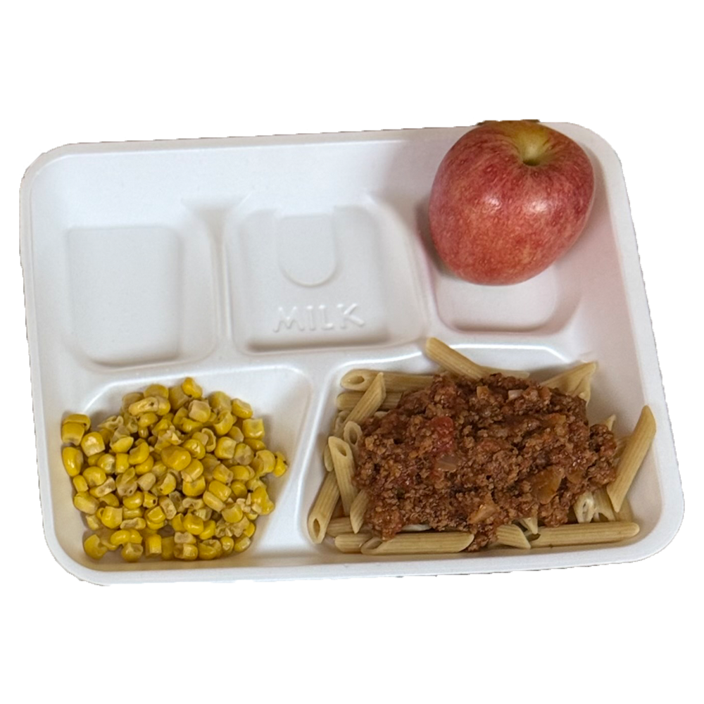 A styrofoam tray filled with pasta corn and an apple
