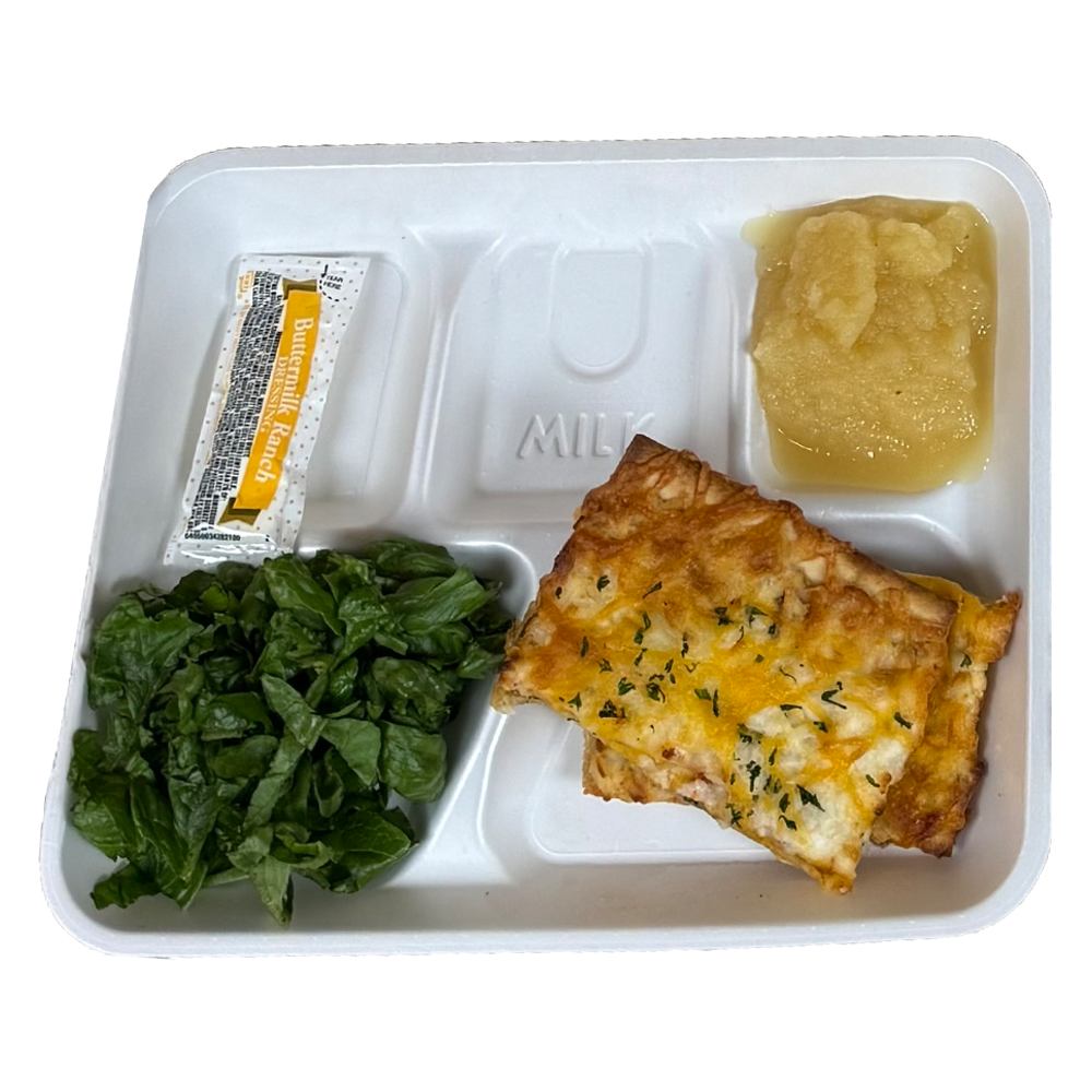 A styrofoam tray with a piece of pizza , spinach and applesauce.