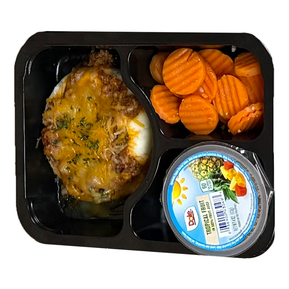 A tray of food with carrots and a container of ranch dressing
