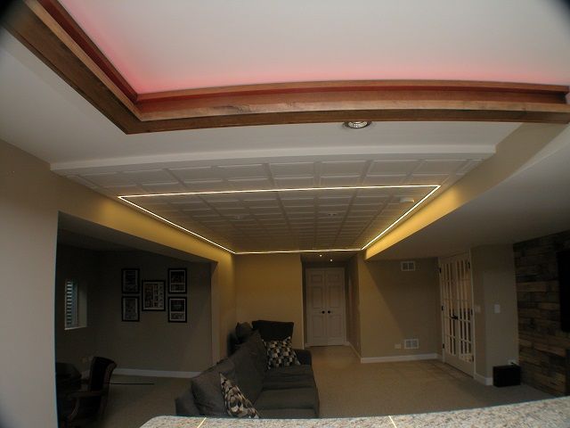 A living room with a couch and pictures on the wall