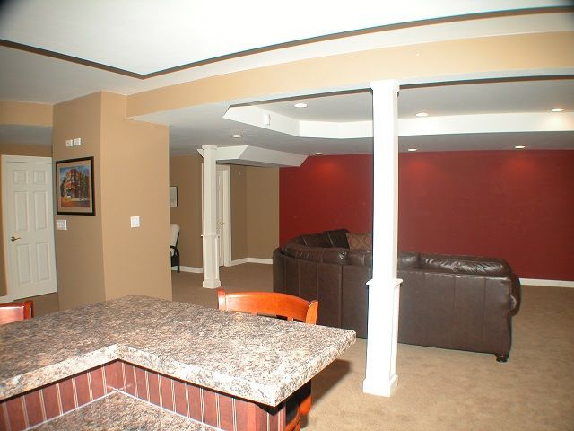 A living room with a couch and a bar