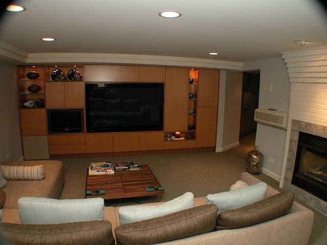 A living room with a flat screen tv and a fireplace
