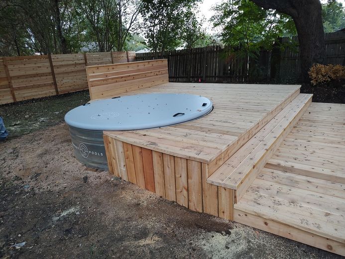 A Hot Tub is Sitting on Top of a Wooden Deck