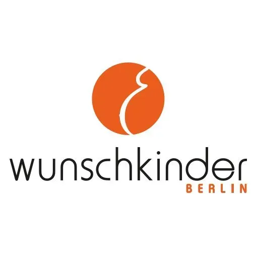 Ein Logo für Wunschkinder Berlin mit einem orangen Kreis
