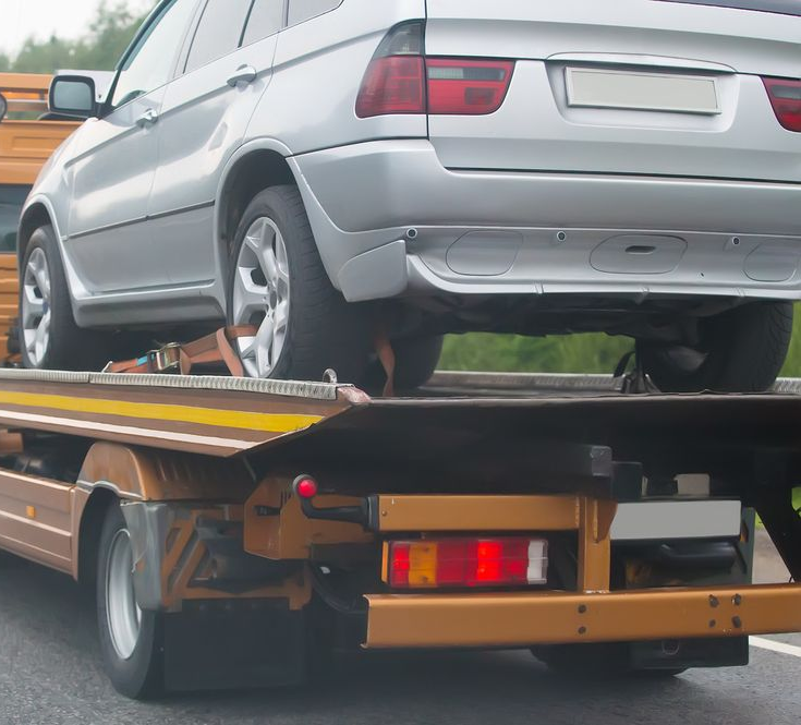 A Silver Suv Secured on a Flatbed — JP's Towing and Transport in Plainlands, QLD