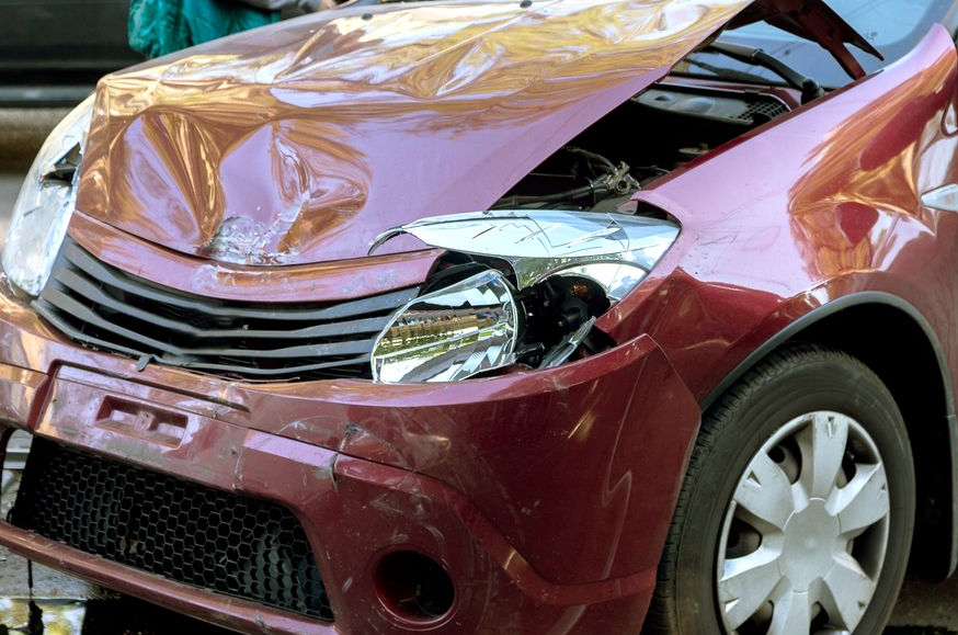 A Close-up of a Damaged Maroon Car — JP's Towing and Transport in Plainlands, QLD