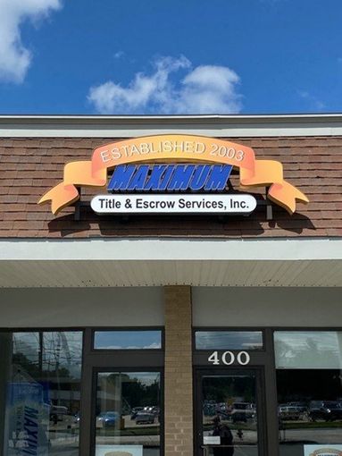 Photo of Maximum Title building with logo