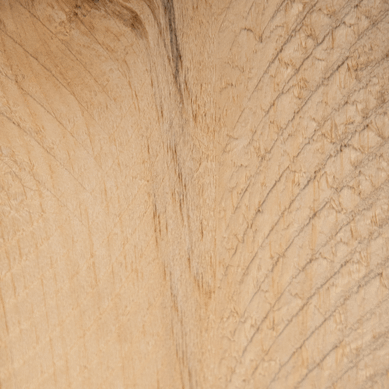 A close up of a piece of wood showing the texture of the wood.