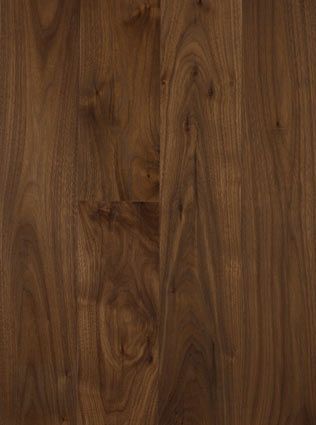 A close up of a wooden floor with a grain and texture.