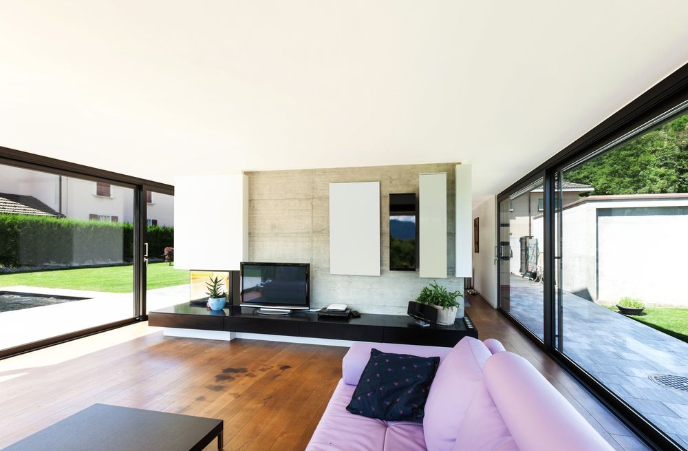 Modern Living Room With Large Glass Walls — ALUBEST Windows & Doors In Southport, QLD