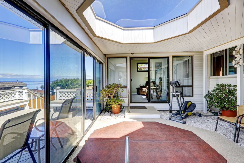 Bright Enclosed Patio With Double Glazed Window — ALUBEST Windows & Doors In Southport, QLD