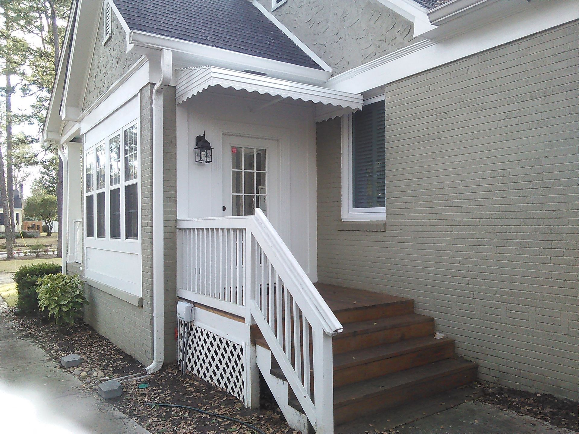 White aluminum awning with fringe
